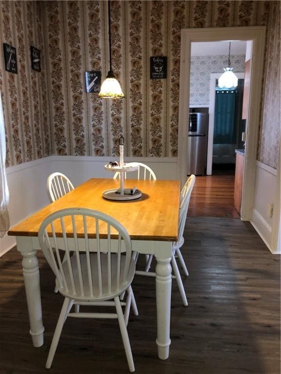 dining area featuring dark wood-type flooring