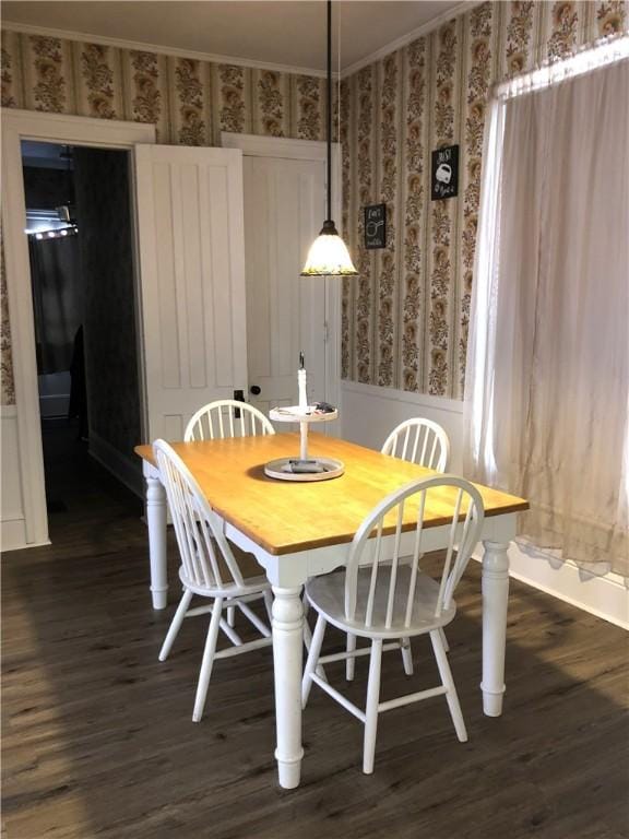 dining space with dark hardwood / wood-style flooring