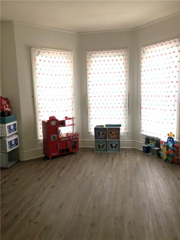 miscellaneous room with dark hardwood / wood-style floors