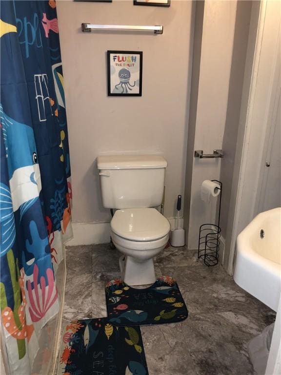 bathroom with toilet and shower with separate bathtub