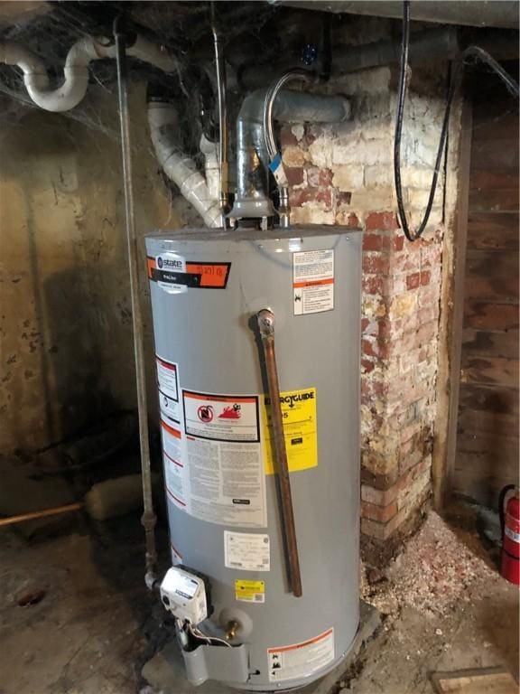 utility room with gas water heater