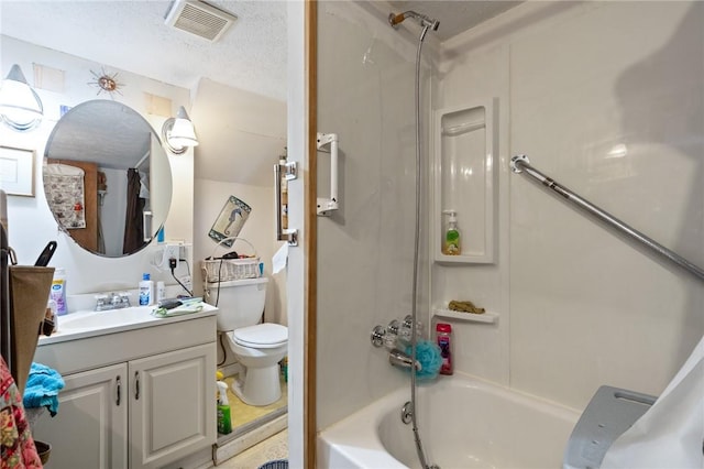 full bathroom with vanity, toilet, bathtub / shower combination, and a textured ceiling