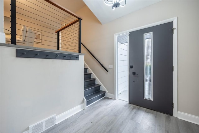 foyer with hardwood / wood-style flooring