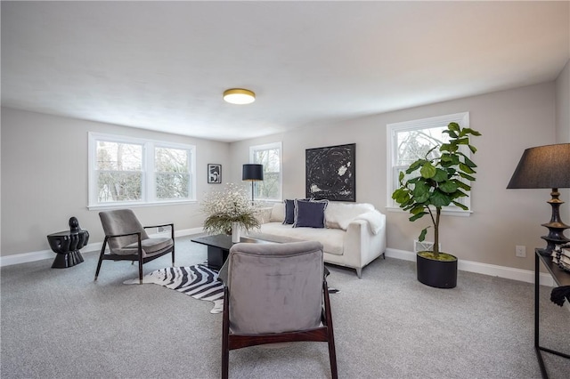 living room featuring a healthy amount of sunlight and carpet