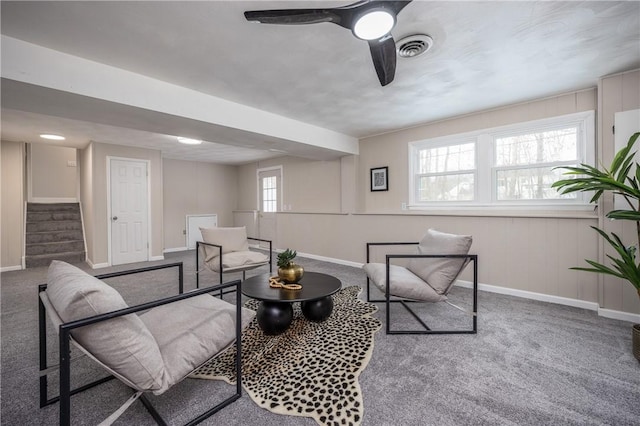 carpeted living room with ceiling fan and a healthy amount of sunlight