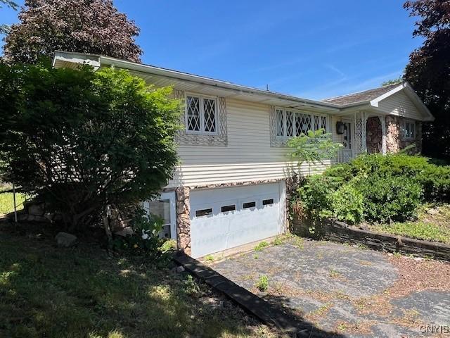 view of property exterior featuring a garage