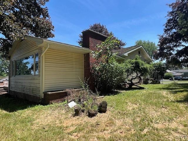 view of home's exterior featuring a yard