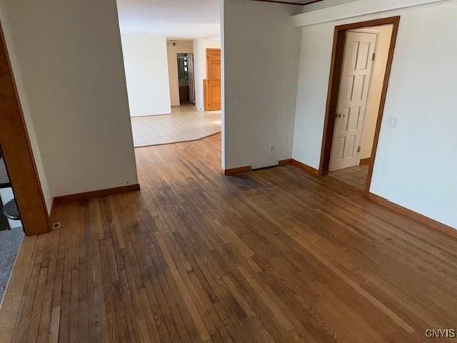 spare room with dark wood-type flooring