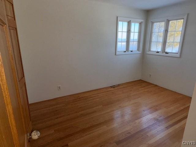 spare room featuring hardwood / wood-style flooring