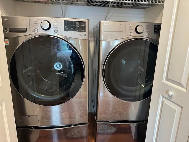 washroom featuring washer and clothes dryer