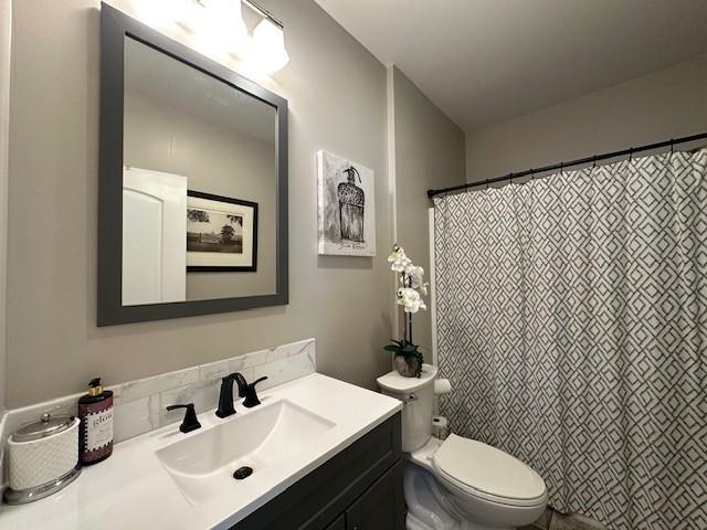 bathroom with vanity and toilet