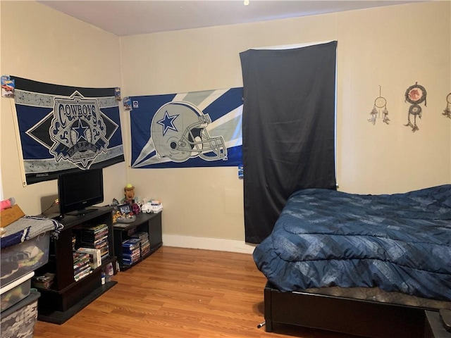 bedroom featuring wood-type flooring