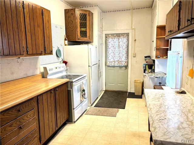 kitchen featuring white range with electric stovetop