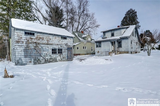 view of snow covered house