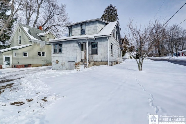 view of snow covered property