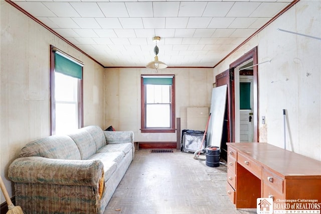 living room with a wealth of natural light and light parquet floors