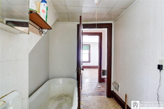 bathroom with toilet and a tub