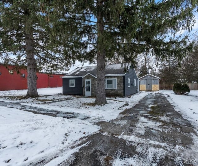 view of front of home with a storage unit