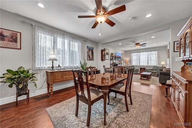 dining room featuring dark hardwood / wood-style flooring and ceiling fan