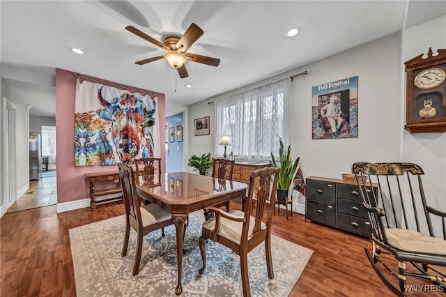 dining room featuring dark hardwood / wood-style floors and ceiling fan