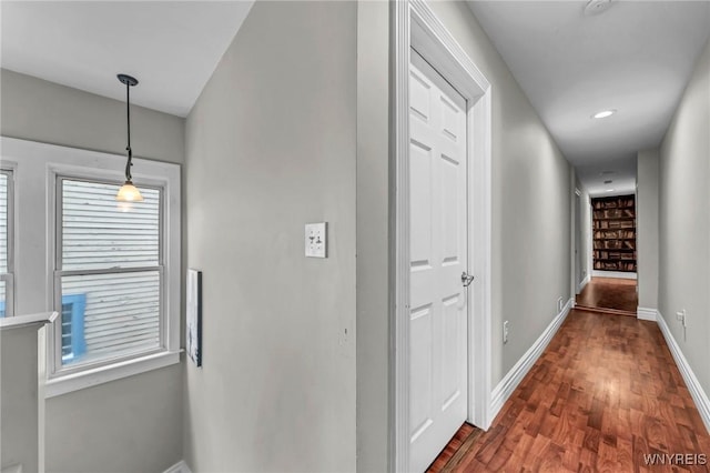 hall with dark hardwood / wood-style flooring