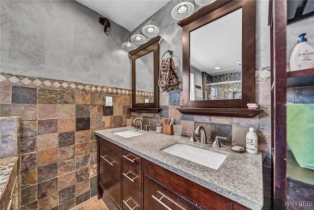 bathroom with tile walls and vanity