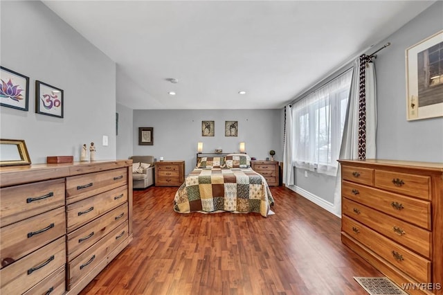 bedroom with dark wood-type flooring