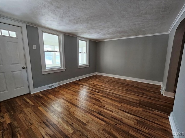 entryway featuring dark hardwood / wood-style floors and a textured ceiling