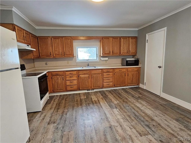 kitchen with crown molding, sink, white appliances, and light wood-type flooring