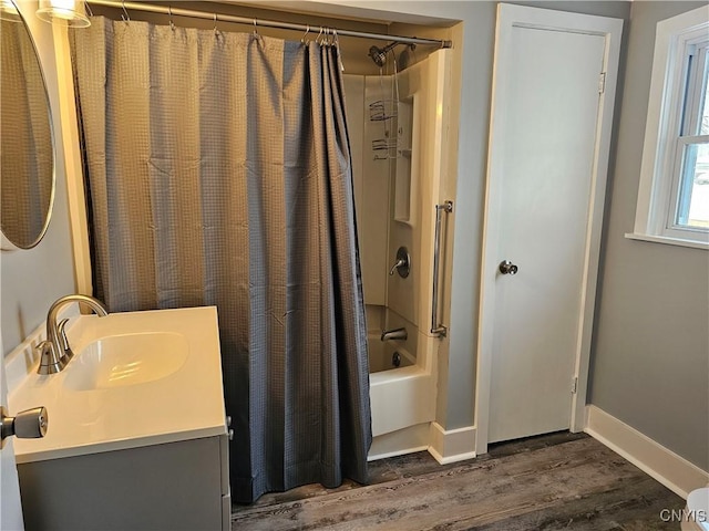 bathroom featuring shower / bath combination with curtain, vanity, and hardwood / wood-style floors