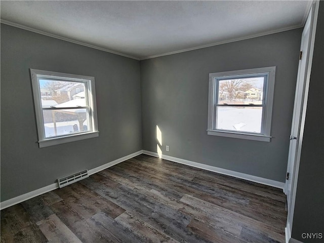 unfurnished room with dark hardwood / wood-style flooring, crown molding, and a healthy amount of sunlight