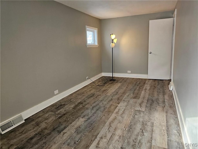 unfurnished room with hardwood / wood-style floors