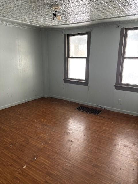 unfurnished room featuring hardwood / wood-style floors