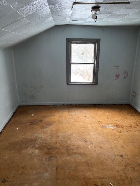 additional living space with lofted ceiling