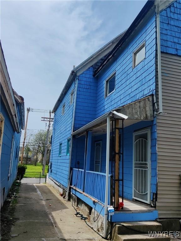 view of side of property featuring a porch