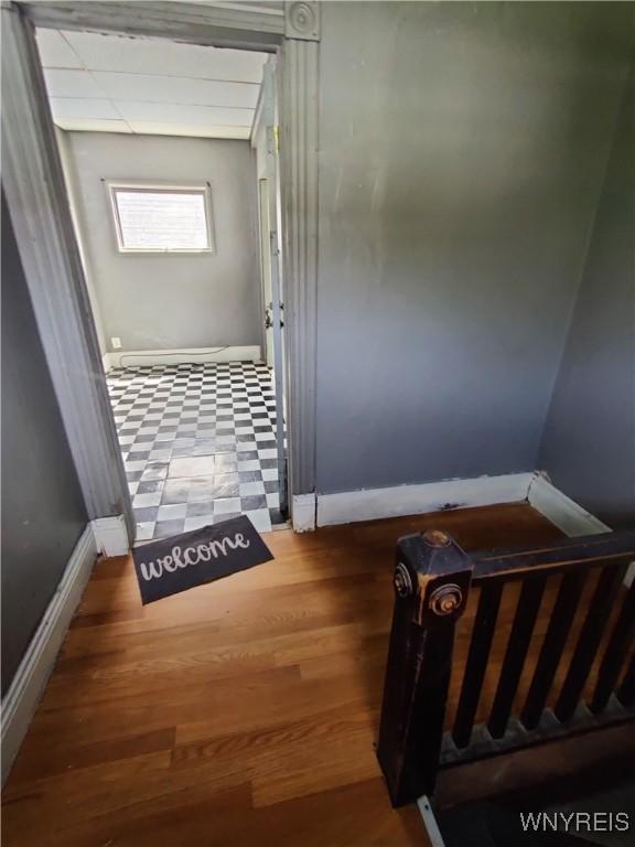 hall with wood-type flooring