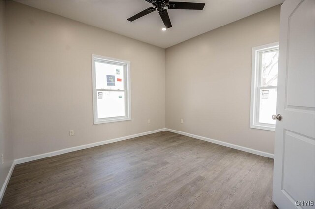 unfurnished room featuring hardwood / wood-style flooring and ceiling fan