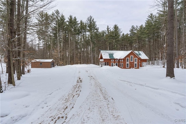 view of front of property featuring a storage unit