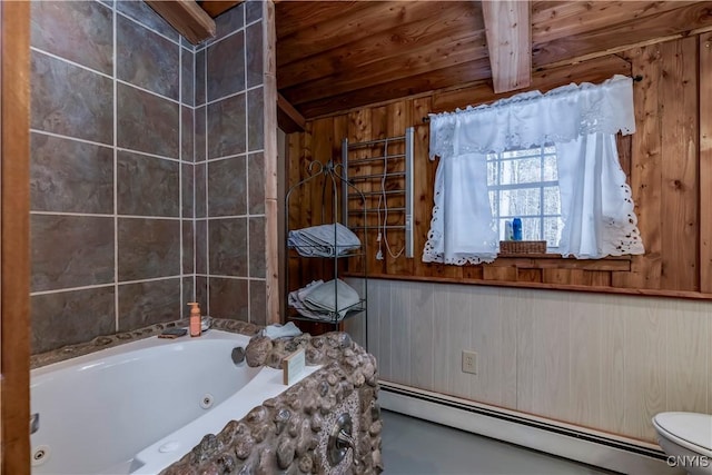 bathroom featuring a washtub, a baseboard heating unit, toilet, beamed ceiling, and wood walls