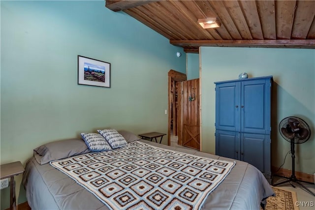 bedroom featuring wood ceiling and lofted ceiling