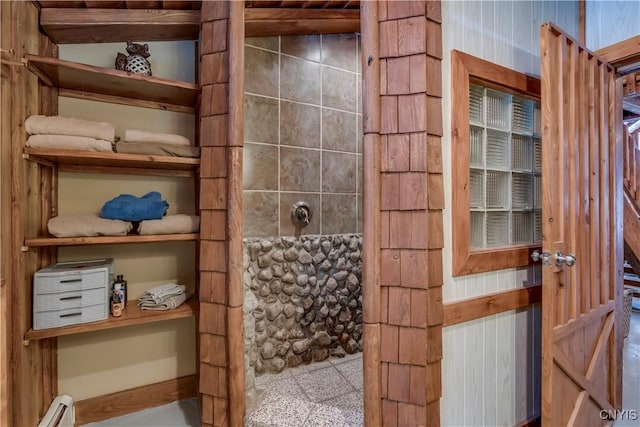 bathroom with lofted ceiling and a baseboard radiator