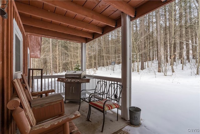 unfurnished sunroom with beam ceiling and wood ceiling