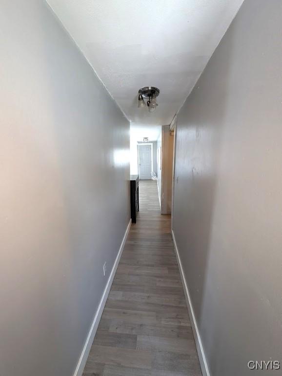 hallway featuring wood-type flooring