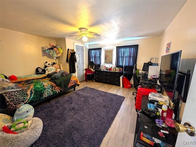 bedroom featuring ceiling fan and light hardwood / wood-style flooring