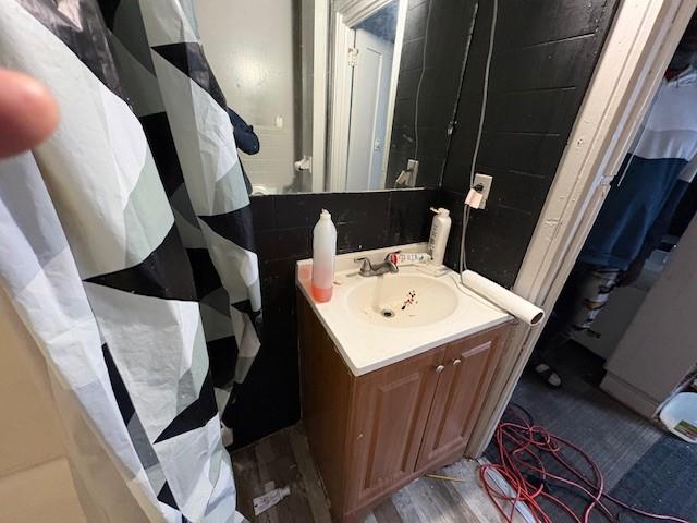 bathroom with vanity and hardwood / wood-style floors