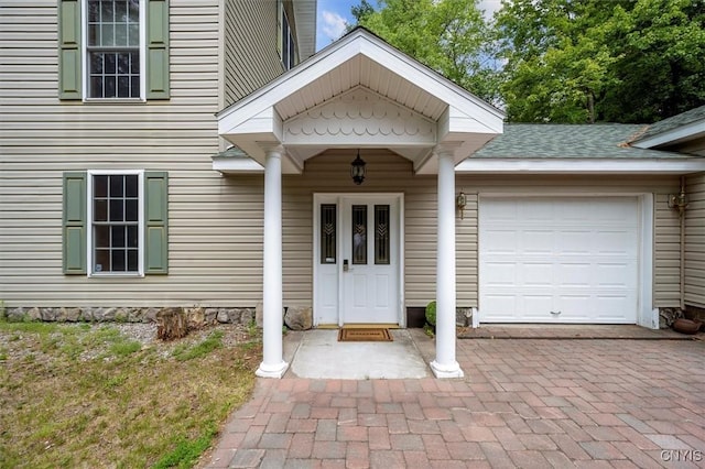 entrance to property featuring a garage