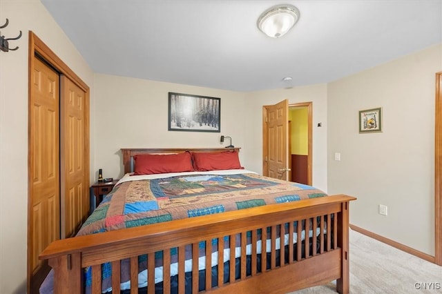 bedroom featuring light carpet and a closet