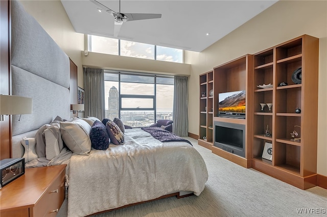 bedroom with multiple windows, carpet flooring, and ceiling fan