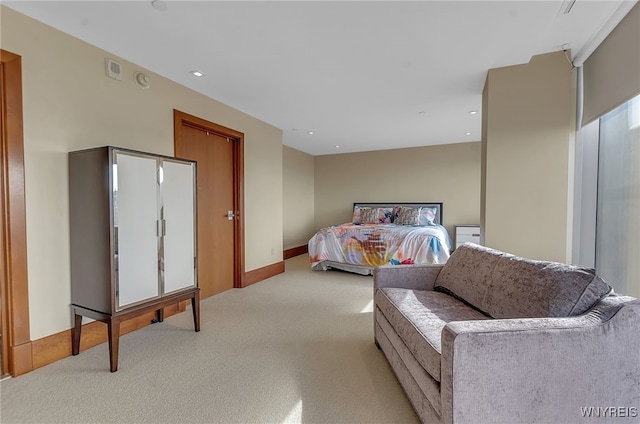 bedroom featuring light carpet