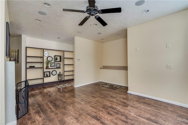 empty room featuring hardwood / wood-style flooring and ceiling fan